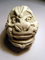 A crude clay model based on the multiple figures image.